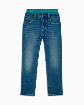 Jeans a lavaggio medio stone washed in cotone stretch con fascia elastica logata ottanio 10-16 anni